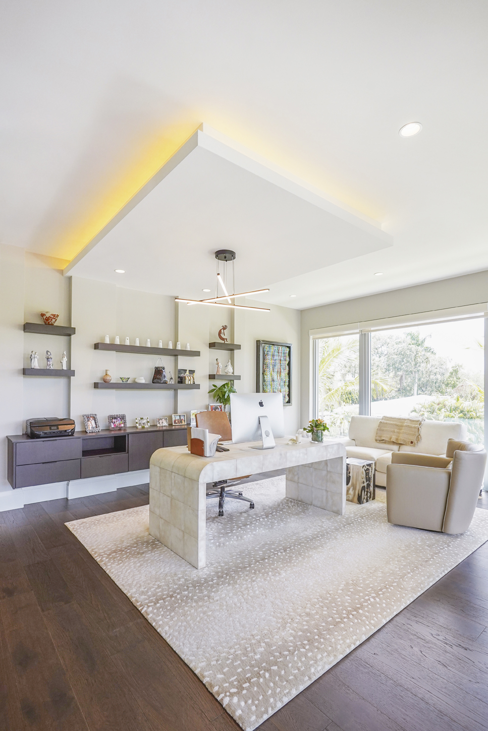 Home office with custom floating shelving