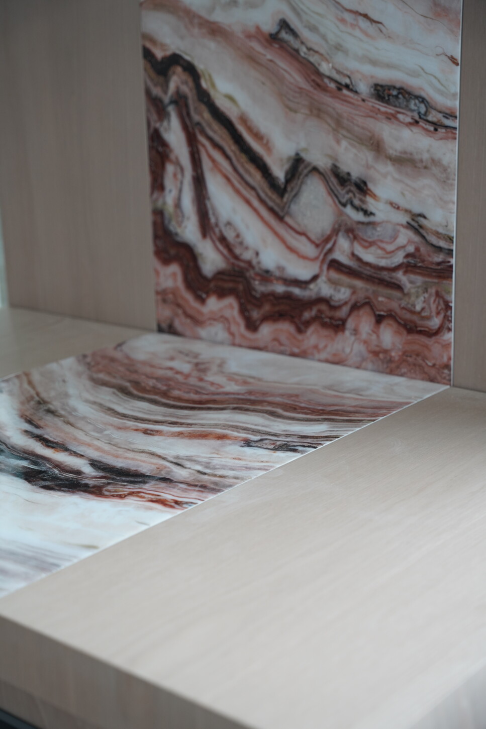 Imitation stone wall cladding with epoxy finish flowing into a custom console top