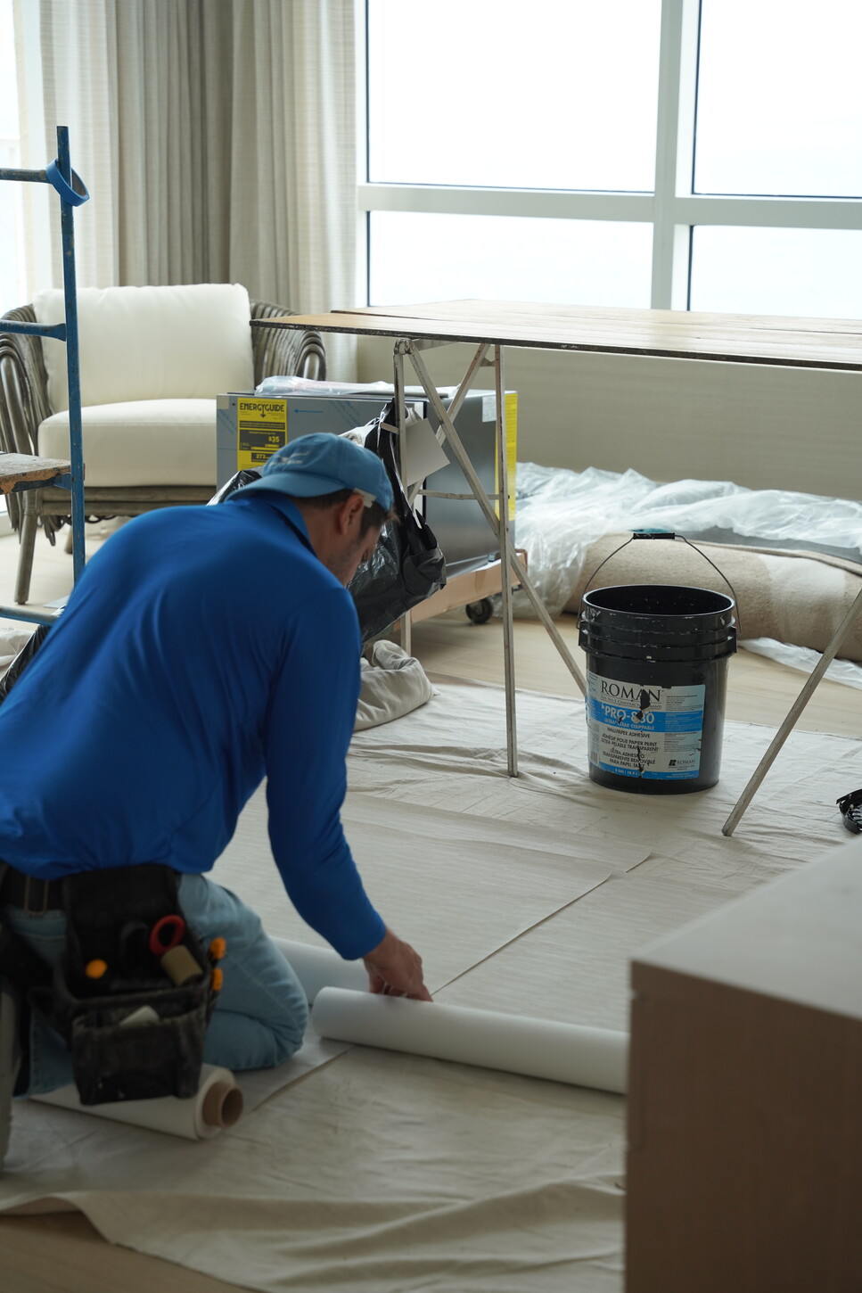 CM Custom Design installer preparing floor protection during on-site installation