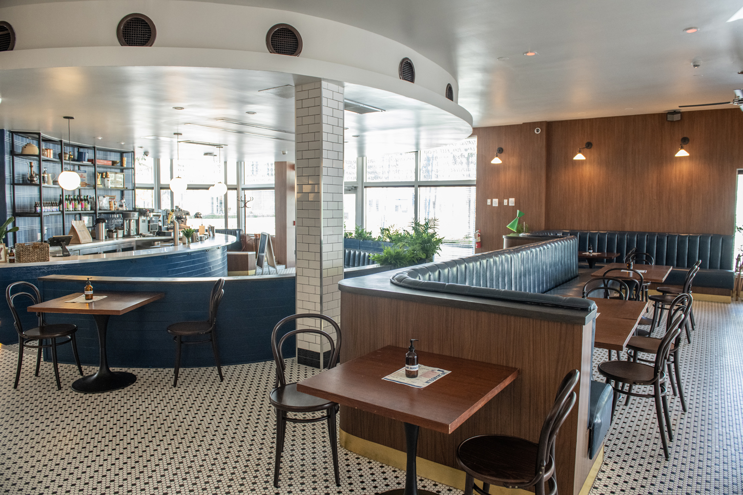 Custom hospitality bar and dining lounge renovation with tile flooring and banquette seating by CM Custom Design
