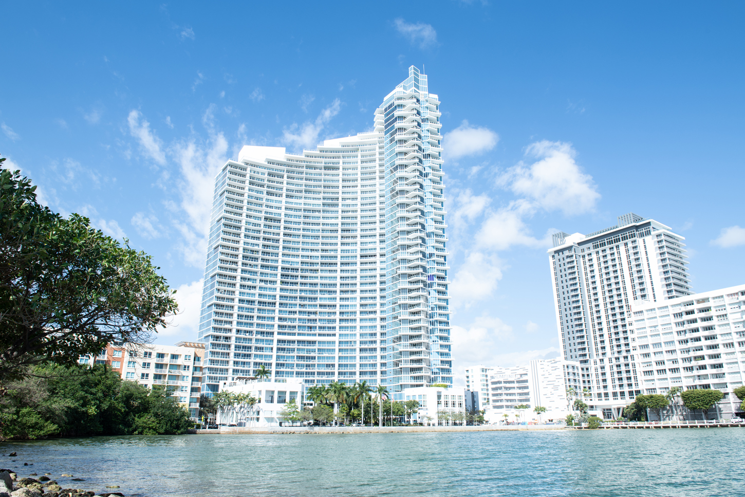 Waterfront Miami skyline with high-rise condominium towers, representing CM Custom Design\u2019s presence across South Florida