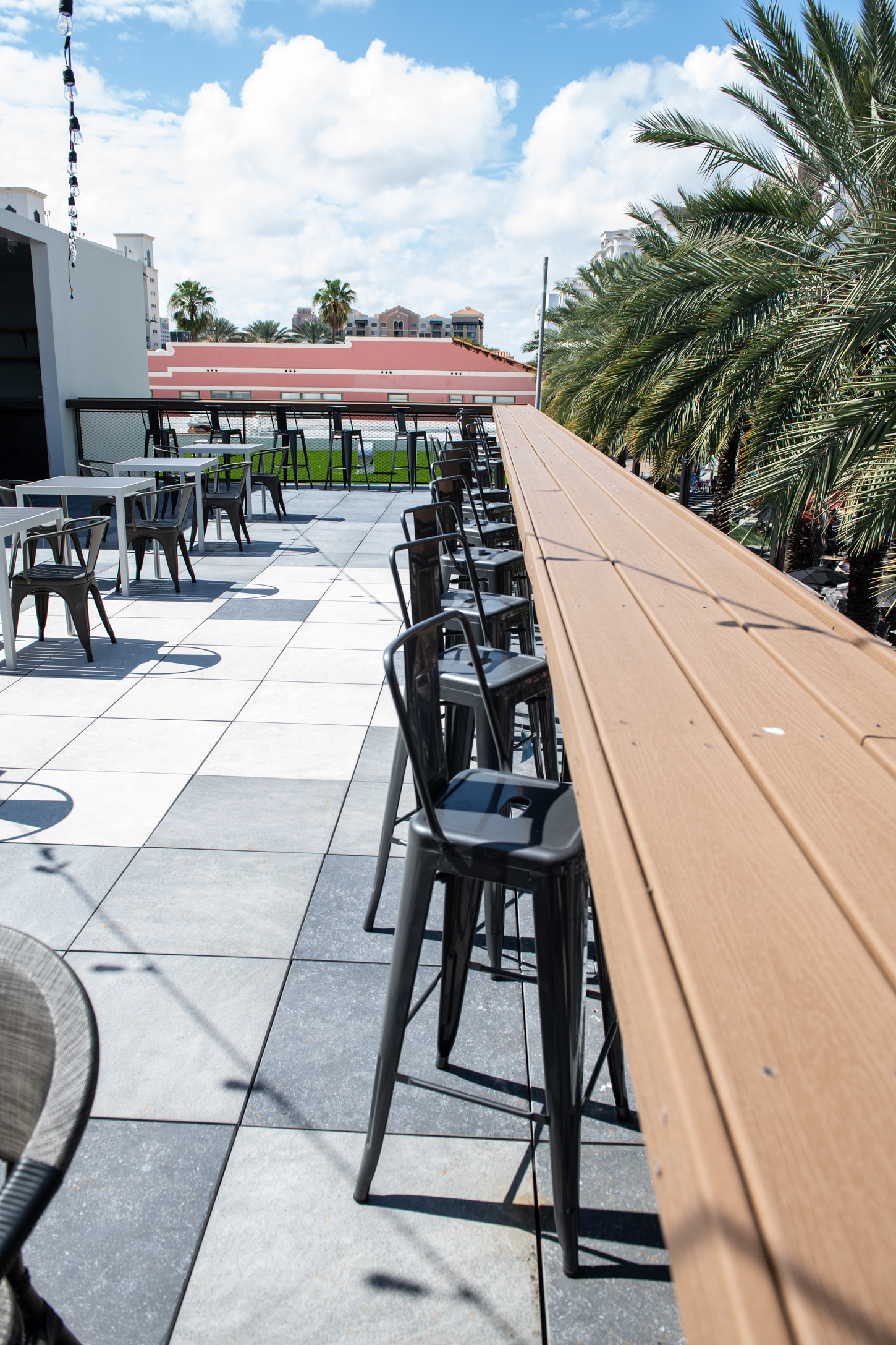 Rooftop restaurant and lounge terrace renovation with string lighting by CM Custom Design in Miami