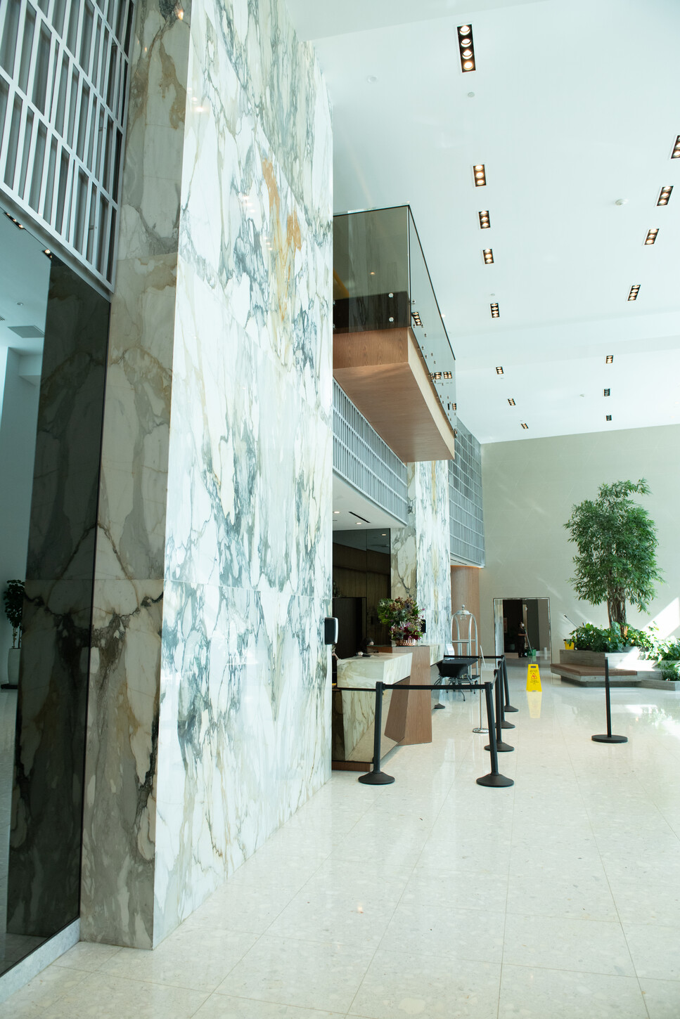 Marble accent wall in a Miami residential building business center