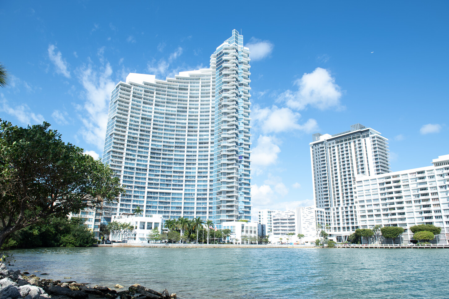 Miami waterfront luxury condo tower viewed from across the bay