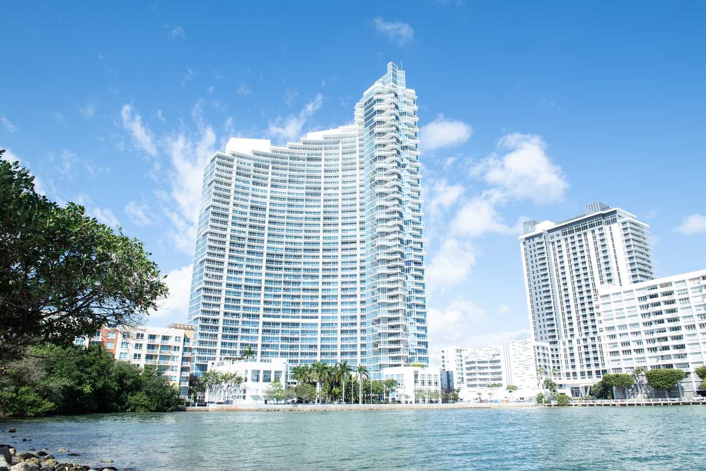 Miami waterfront luxury condo tower along the skyline