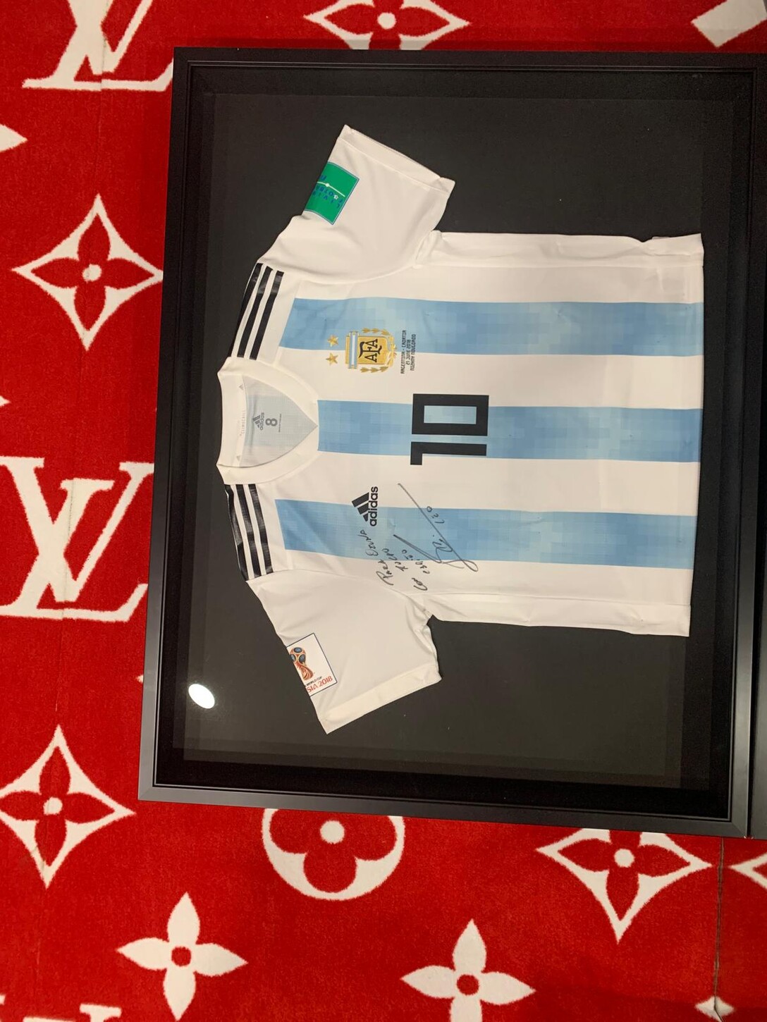 Framed signed jersey displayed in the residence&rsquo;s custom closet