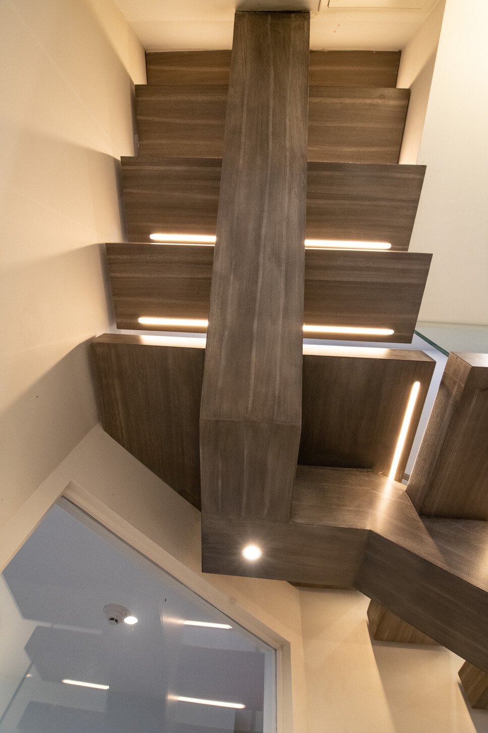 Floating staircase illuminated at night with Fort Lauderdale skyline view