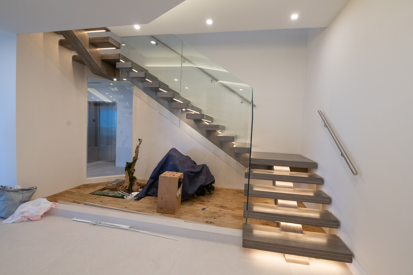 Floating metal staircase with no visible supports in a Fort Lauderdale penthouse