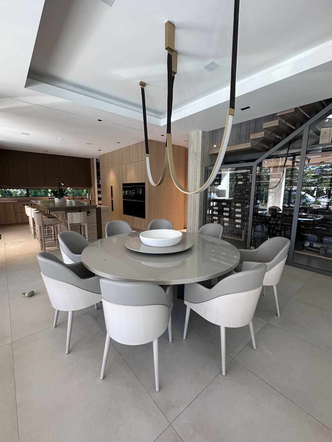 Media room with marble-topped television console in a Coral Gables residence