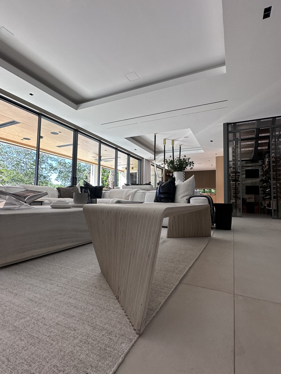 Primary bedroom with marble-finished ensuite bathroom visible in a Coral Gables residence