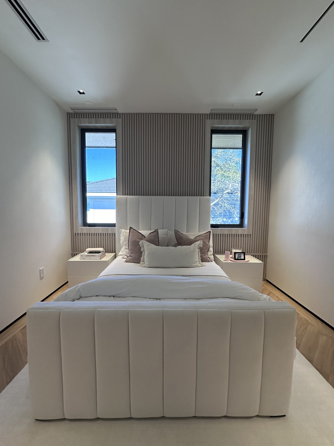 Detail of textured wallcovering next to wood-slat paneling in a Coral Gables home