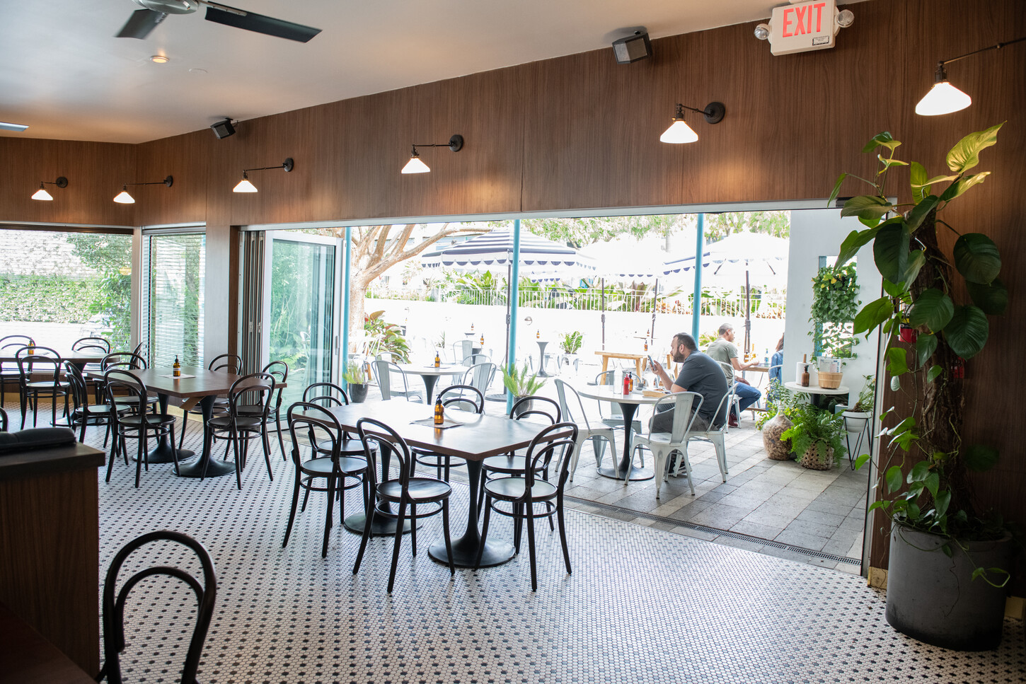 Service counter with bar stools, menu board, and white column