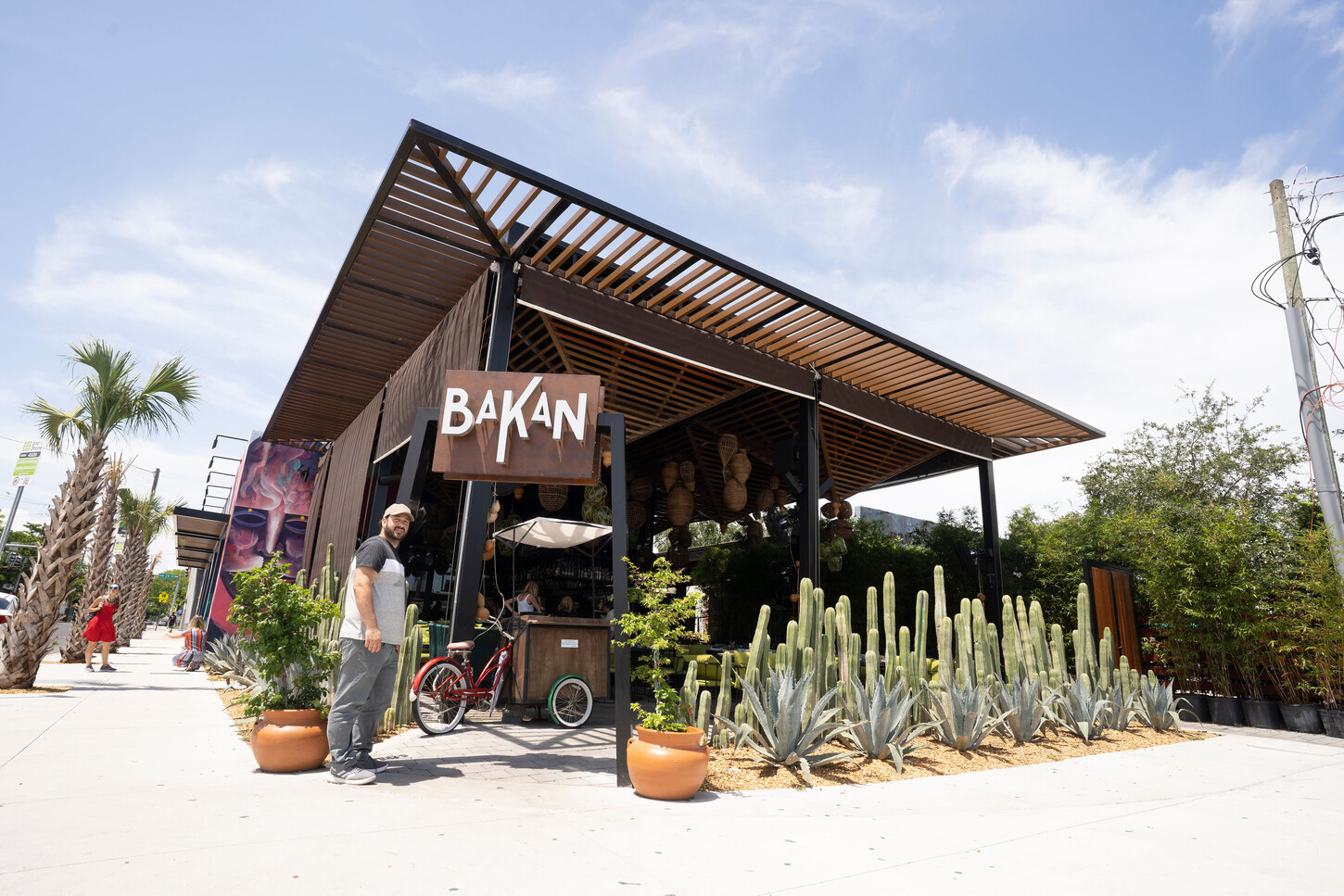 Custom wood slat canopy on a steel frame seen from the street at Bakan Wynwood in Miami