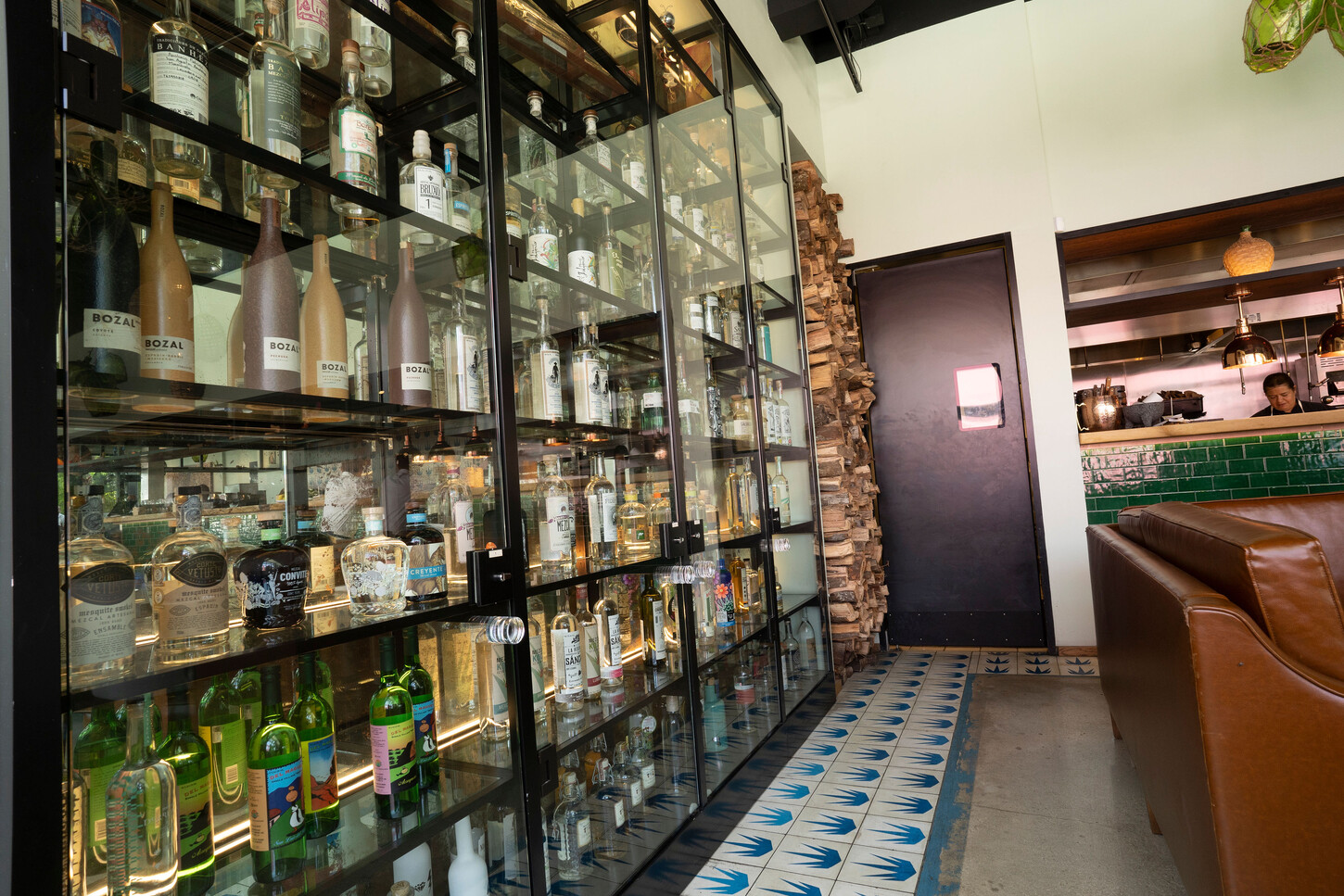 Fabricated steel and glass bottle display case at Bakan Wynwood restaurant in Miami