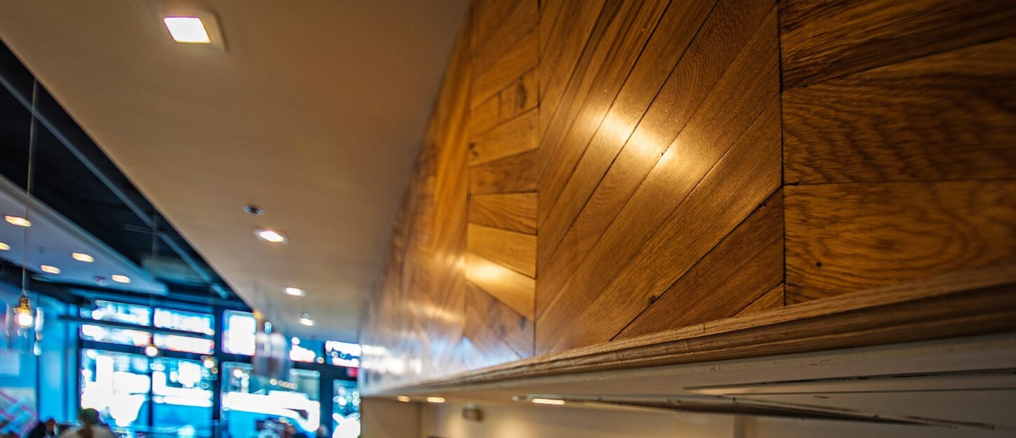 Close detail of chevron wood wall paneling in a Miami restaurant