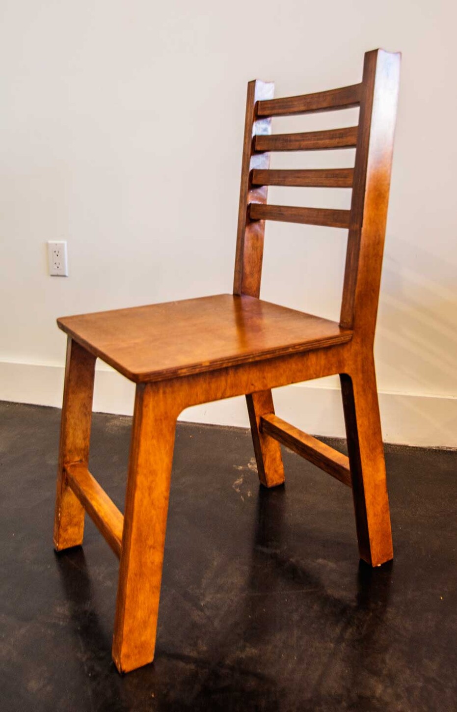 Custom ladder-back wood restaurant chair, front view, built for a Miami restaurant