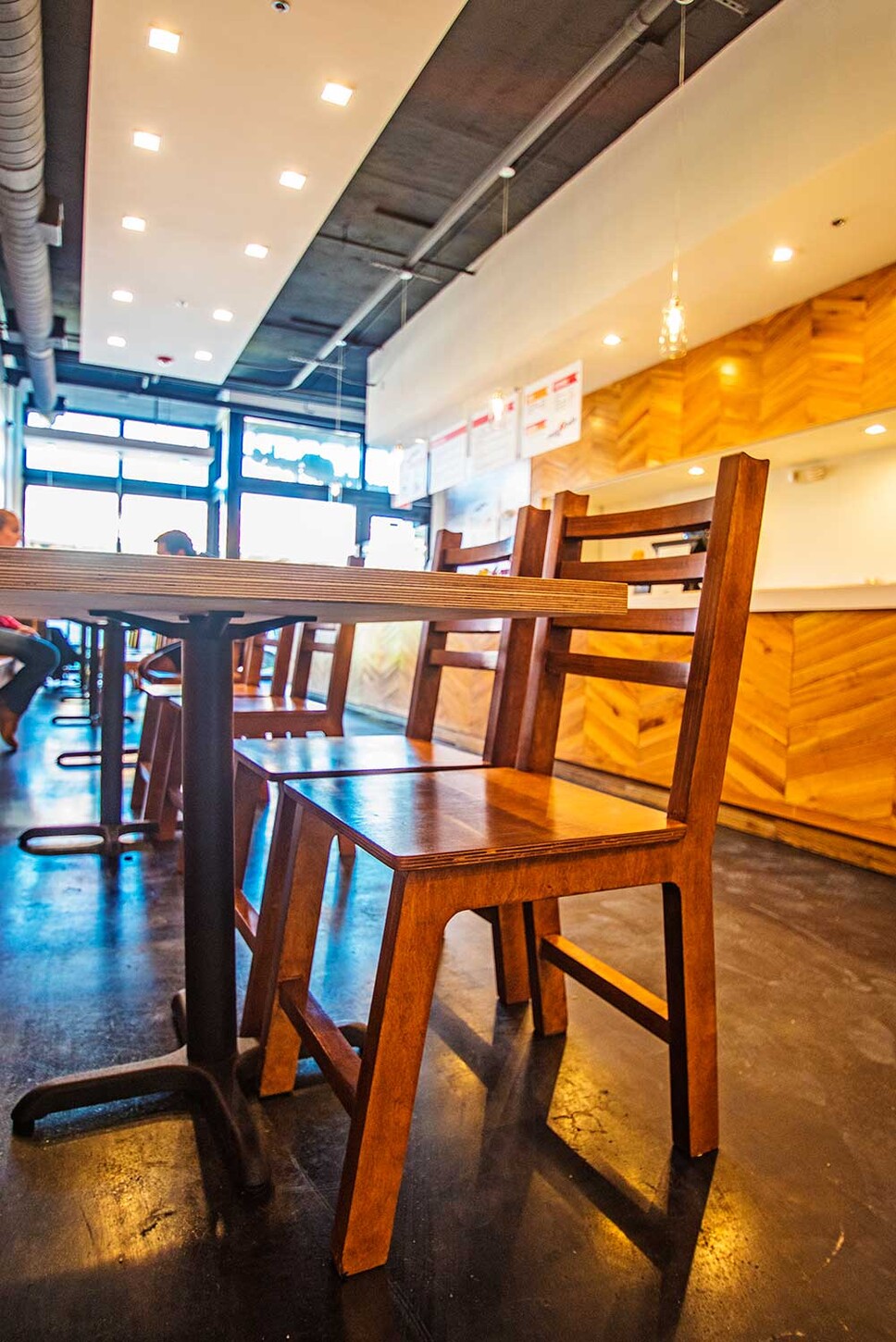 Custom wood restaurant chair and table in a Wynwood, Miami dining room