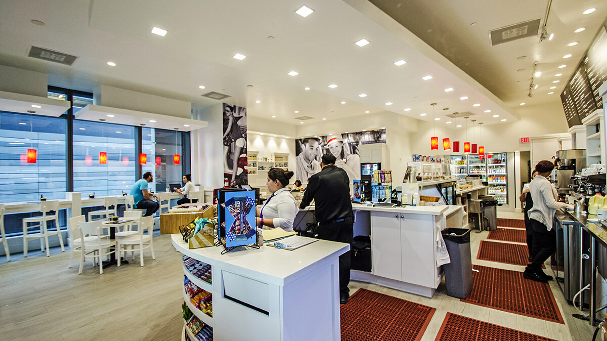 Checkout counter and service area with custom millwork in a Brickell coffee shop, Miami