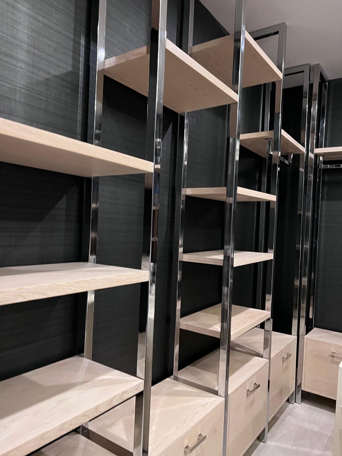 Custom wood and metal hybrid millwork shelving in the spa interior