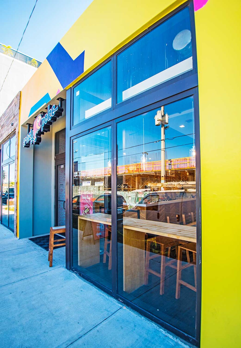 Wynwood, Miami restaurant storefront windows with custom wood seating inside