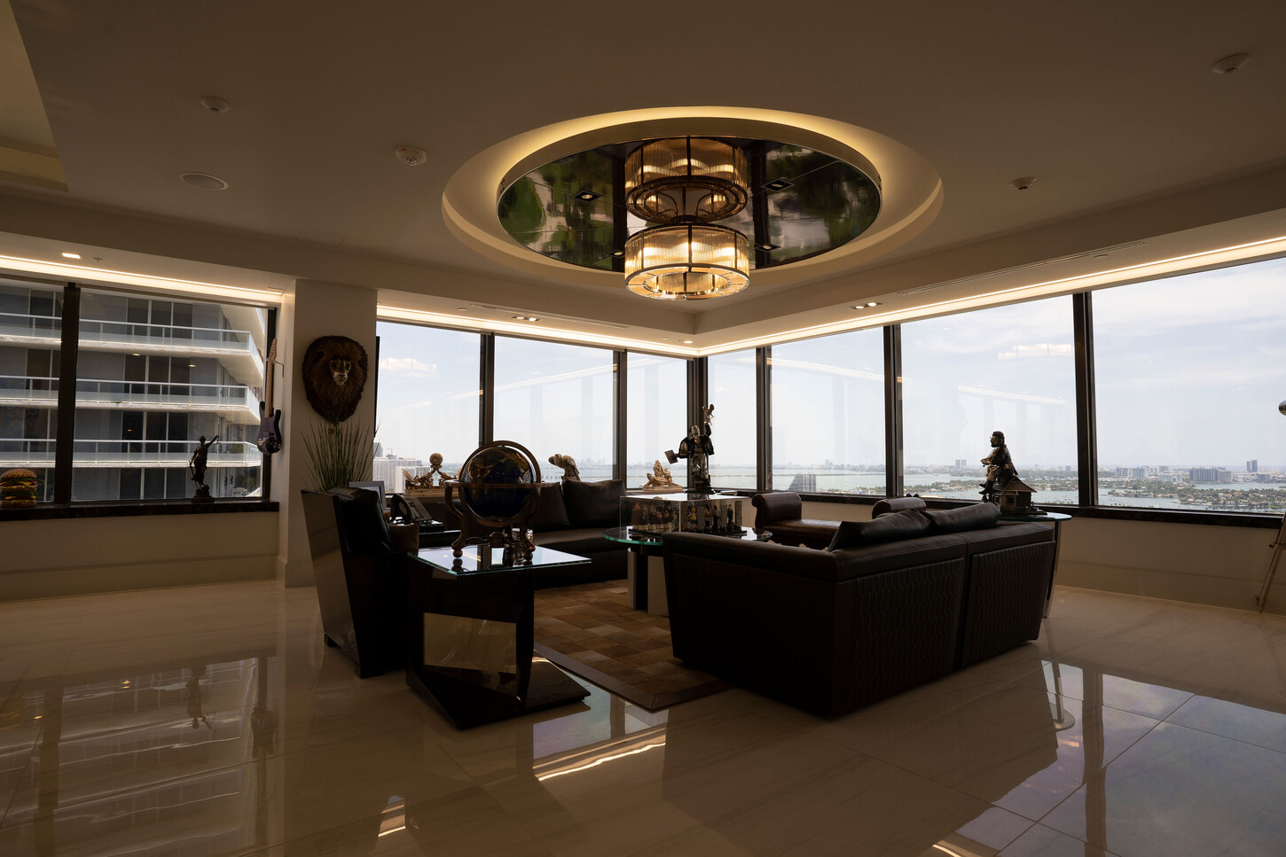 Executive lounge with a round coffered ceiling and chandelier at the Zarco law firm in Florida