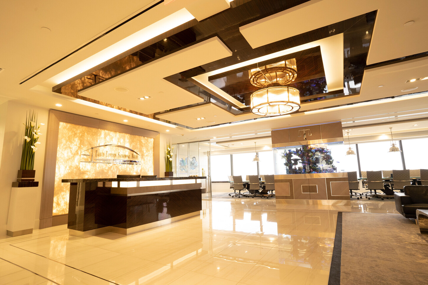 Law firm lobby millwork: wide view of the custom reception desk at the Zarco law firm in Florida