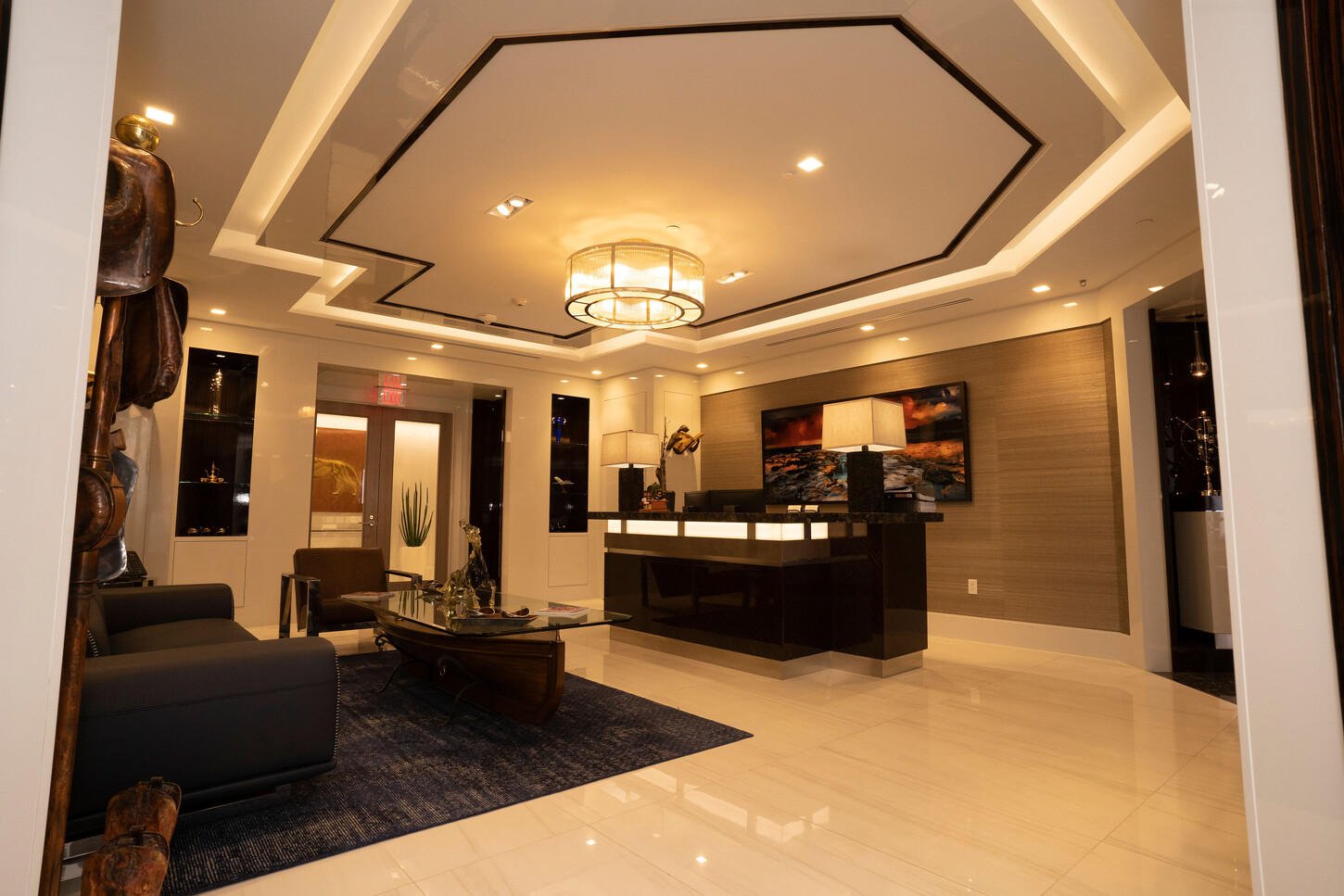Reception desk under an octagonal coffered ceiling, wide view, at the Zarco law firm in Florida
