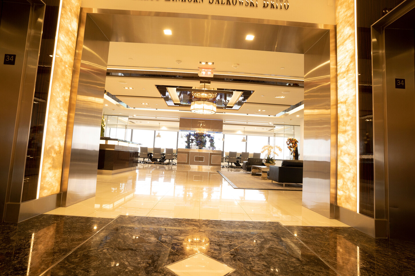 View through the elevator lobby to the reception area of the Zarco law firm in South Florida